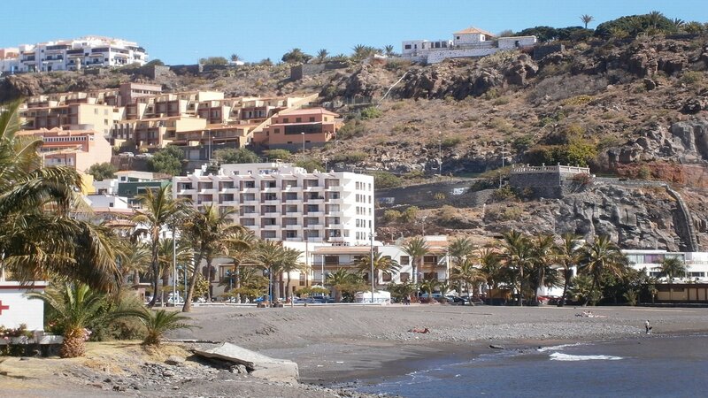 Beachfront buildings on a hillside