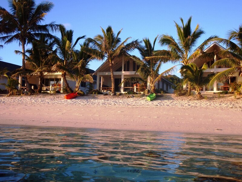 Beachfront bungalows at sunset