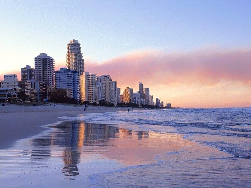 beachfront city at sunset
