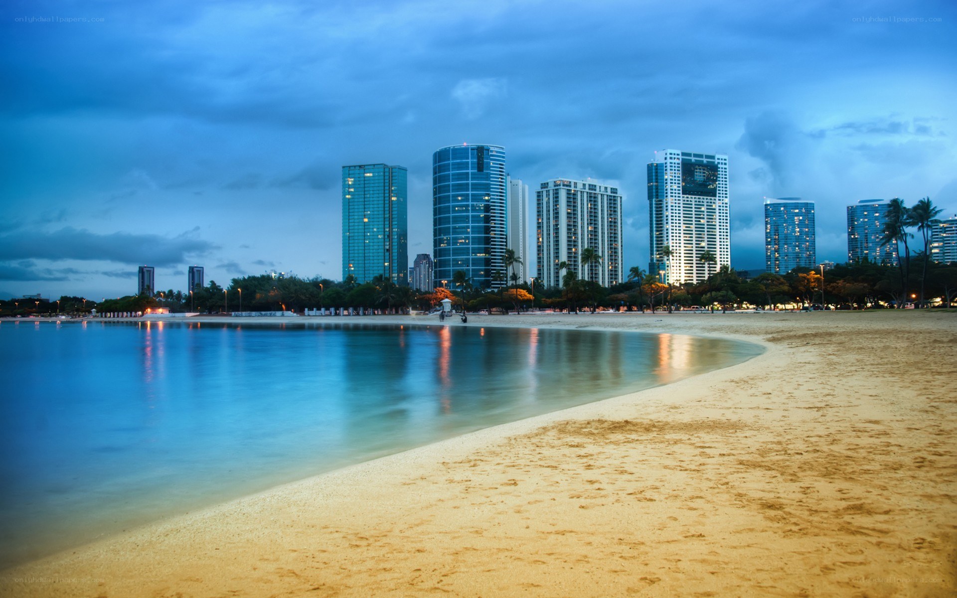 beachfront city skyline at dusk