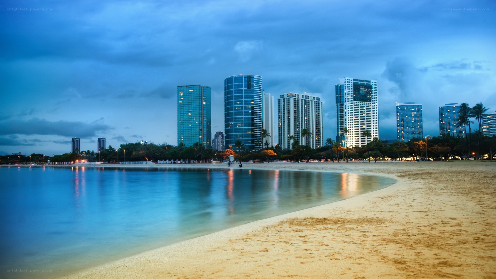 beachfront city skyline at dusk