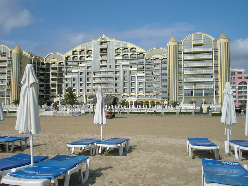 Beachfront hotel with lounge chairs