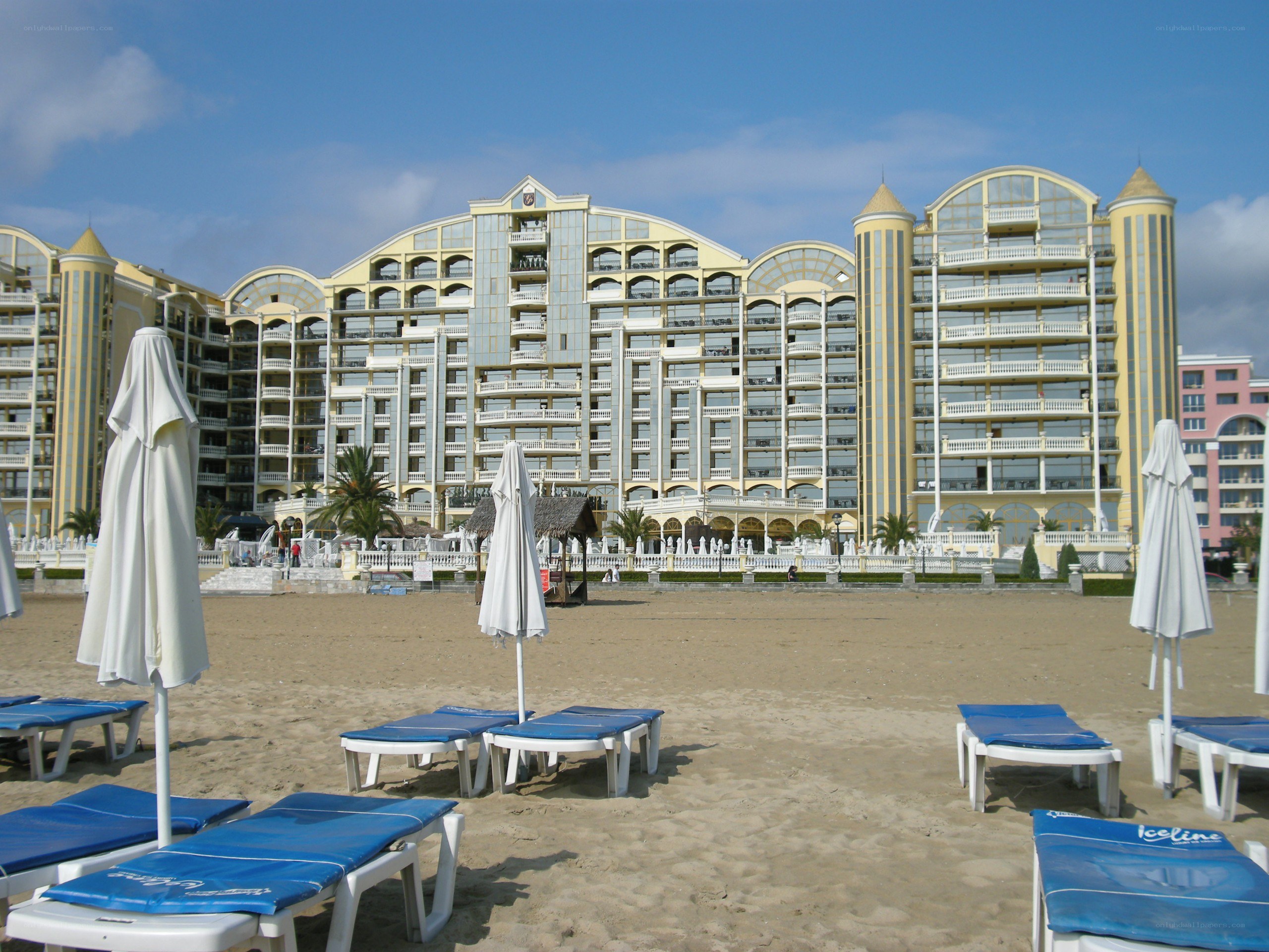 Beachfront hotel with lounge chairs
