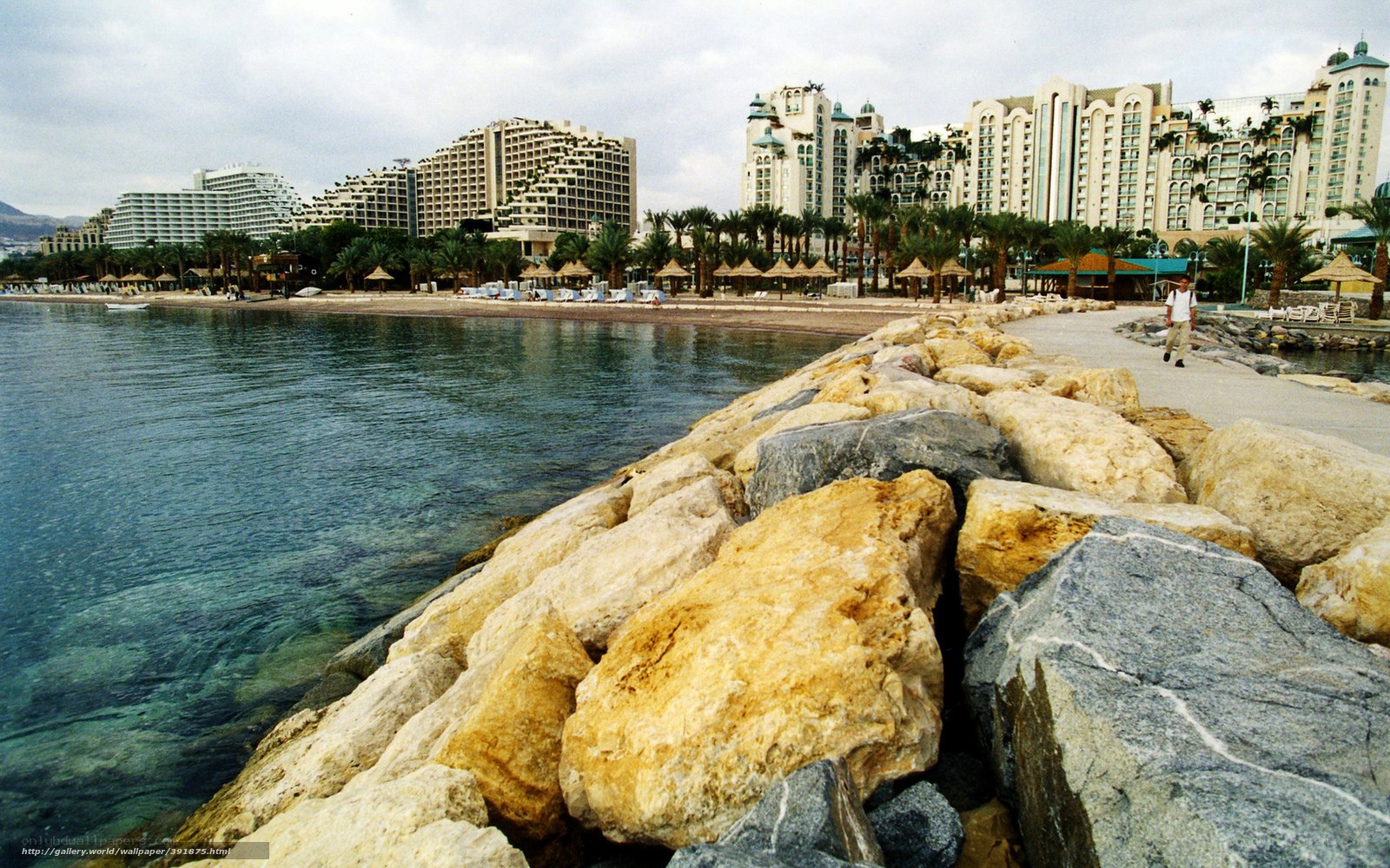 Beachfront resort with rocky breakwater