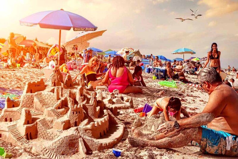 Beachgoers build sandcastle