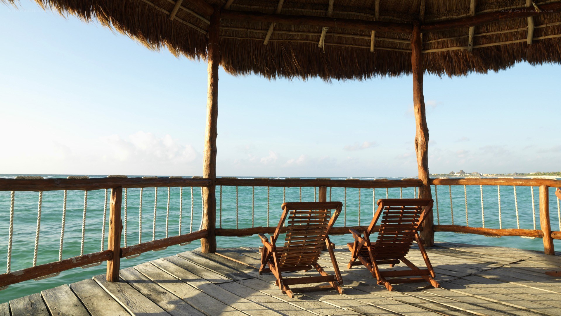Beachside cabana with lounge chairs