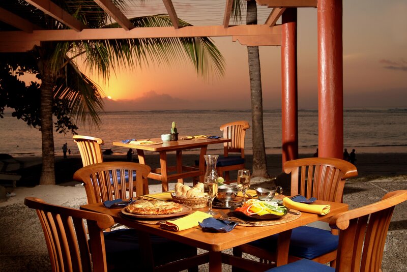 Beachside dining at sunset