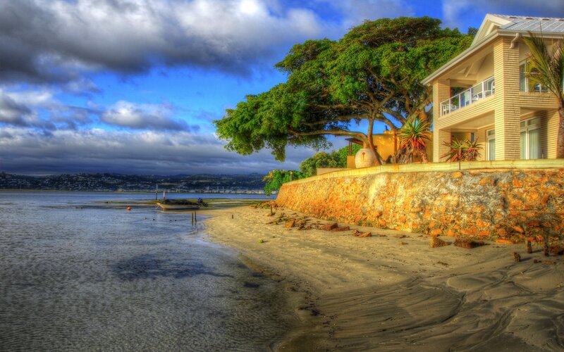 Beachside house with stone wall