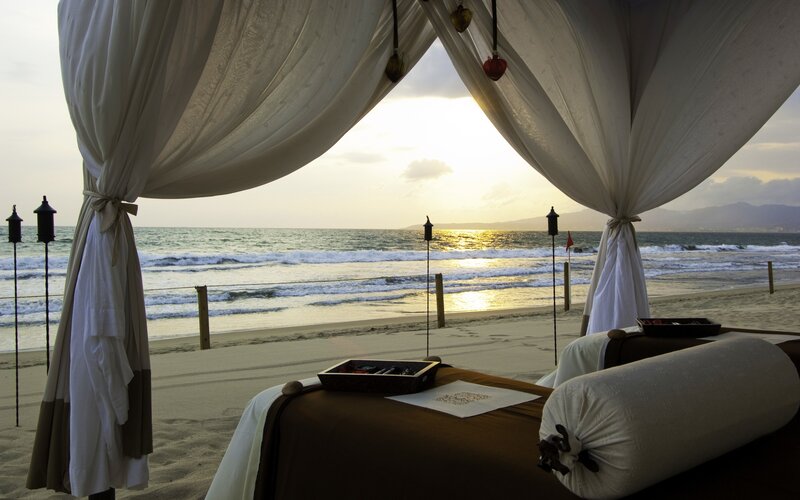 Beachside massage setup at sunset