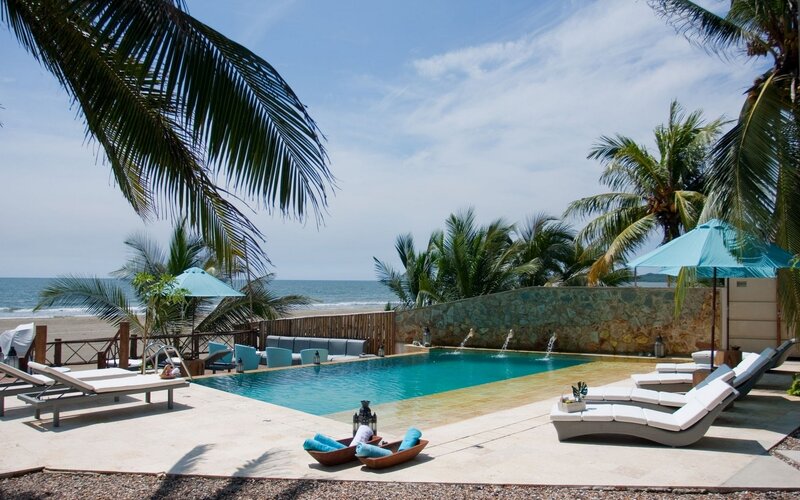 Beachside pool with palm trees