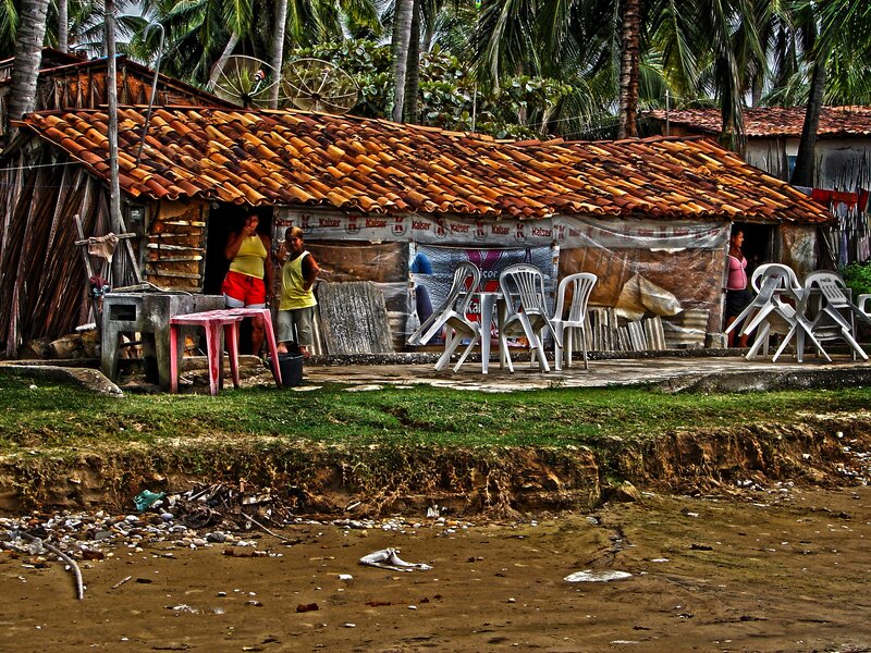 Beachside shack with plastic chairs