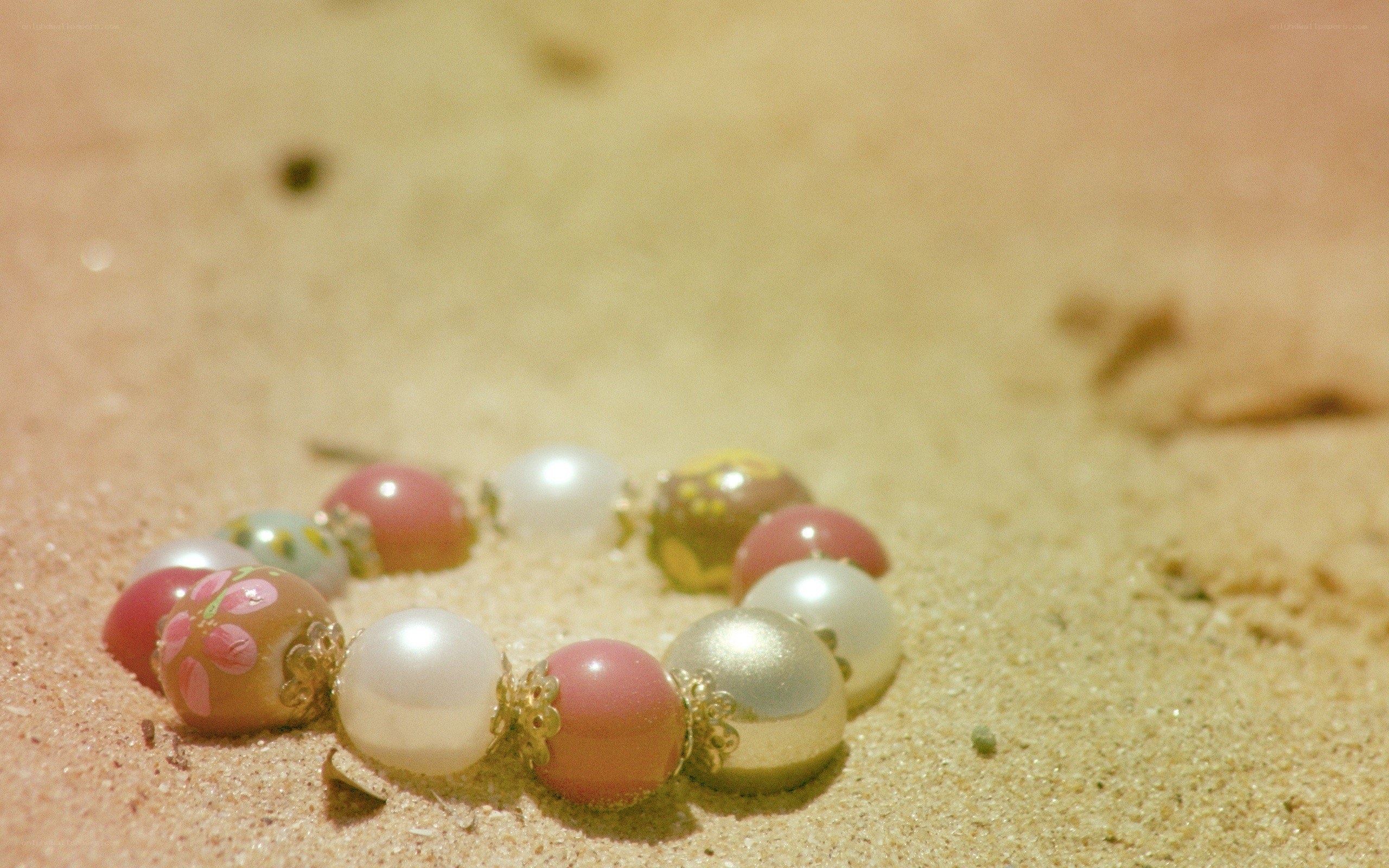 beaded bracelet on sand