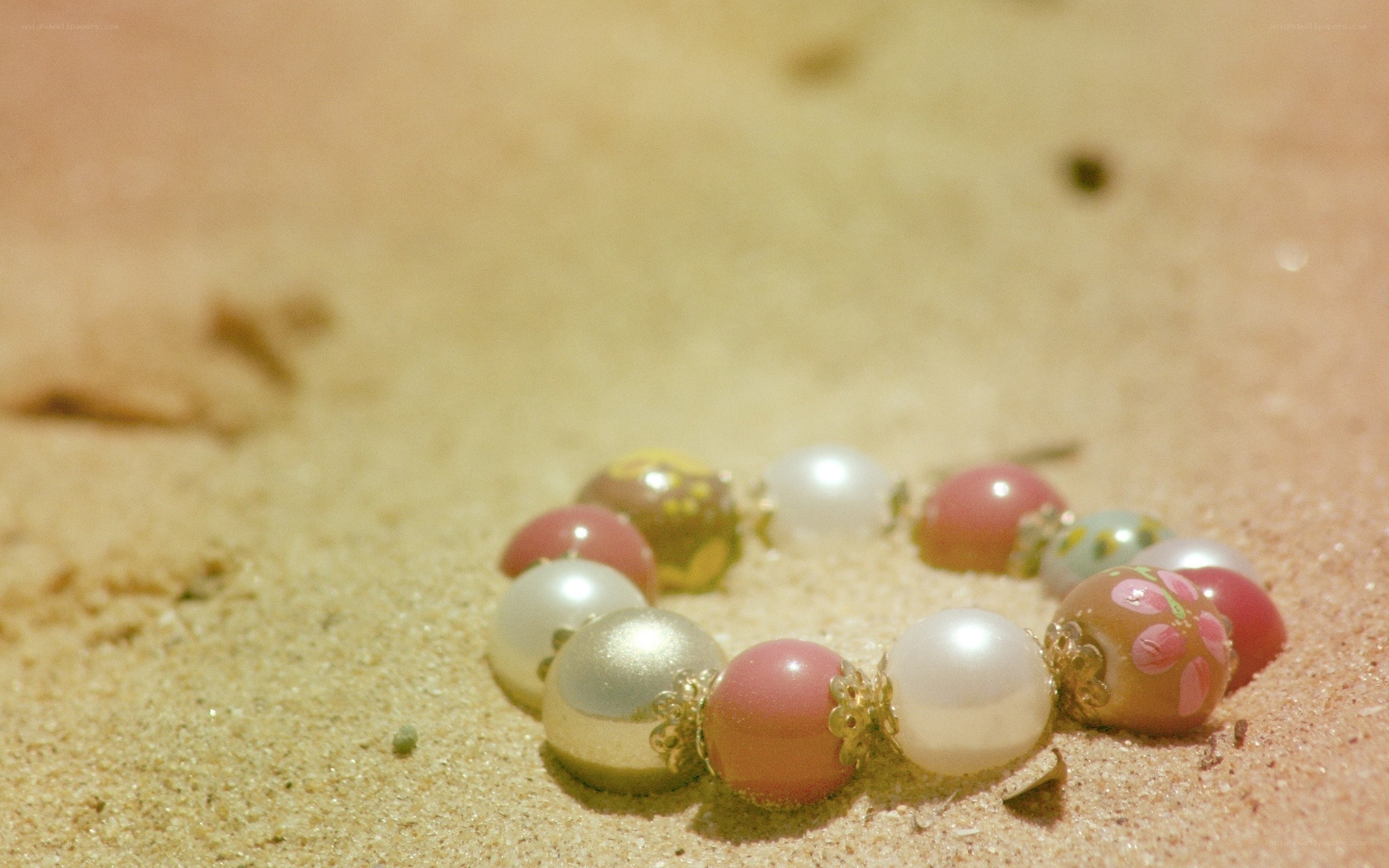 beaded bracelet on sand