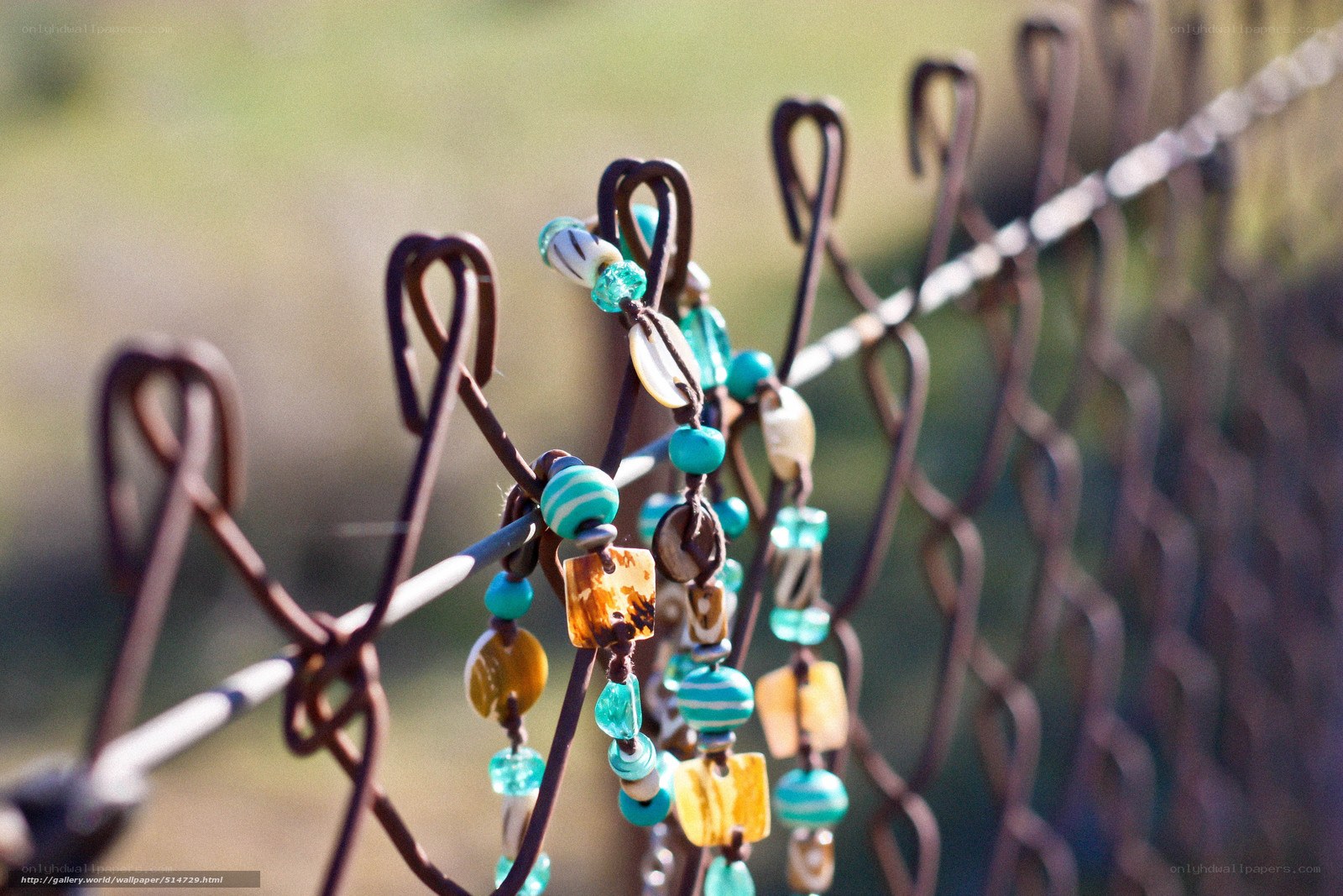 Beaded bracelets on a fence