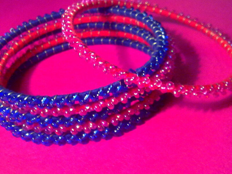 Beaded bracelets on pink