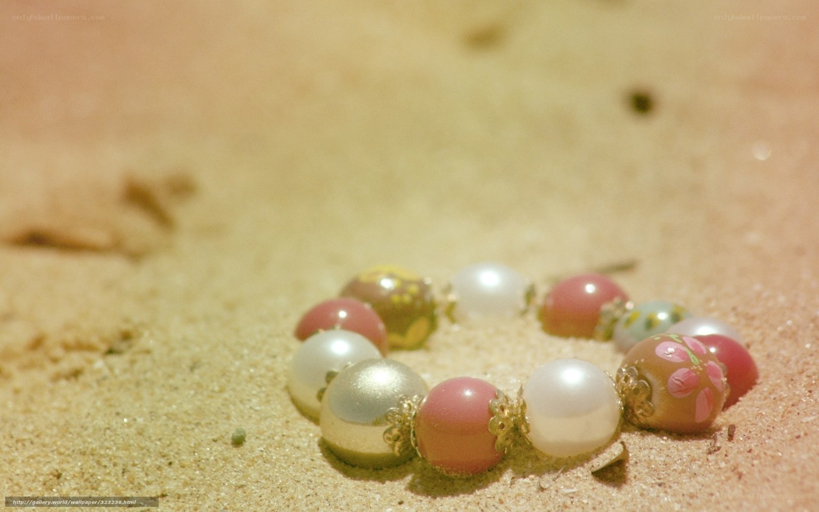 beads on sandy beach