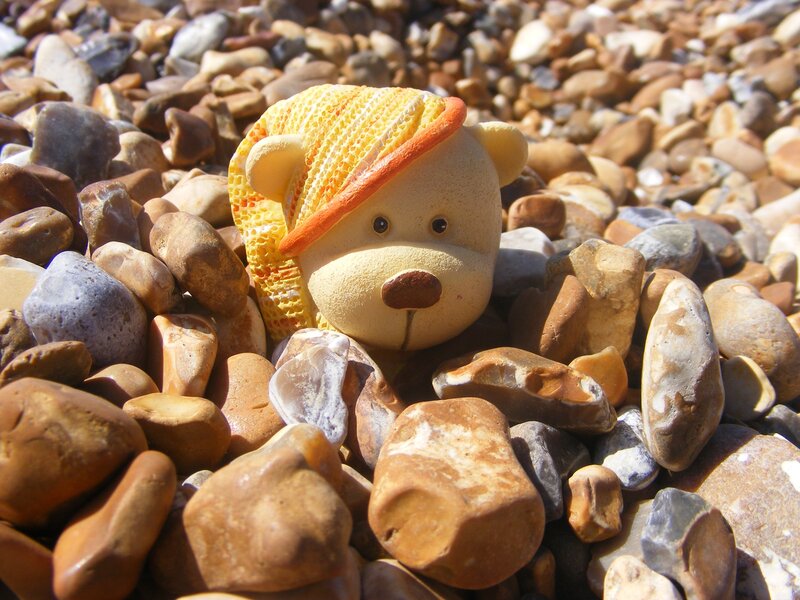 Bear Figurine on Pebbles