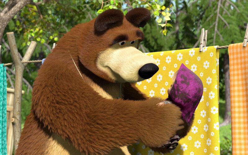 Bear Holding a Doll — Brown