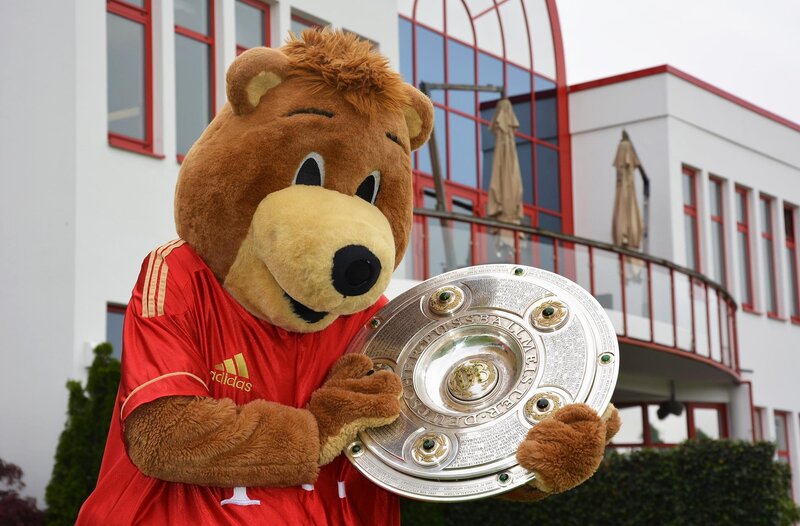 bear mascot with trophy