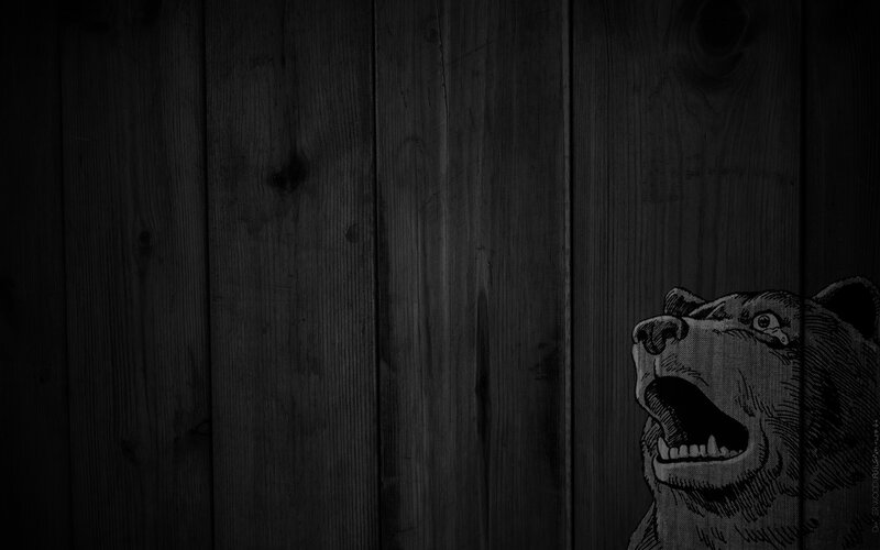 bear roaring on wood