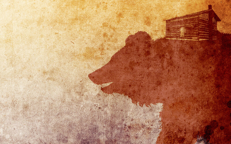 bear silhouette with cabin
