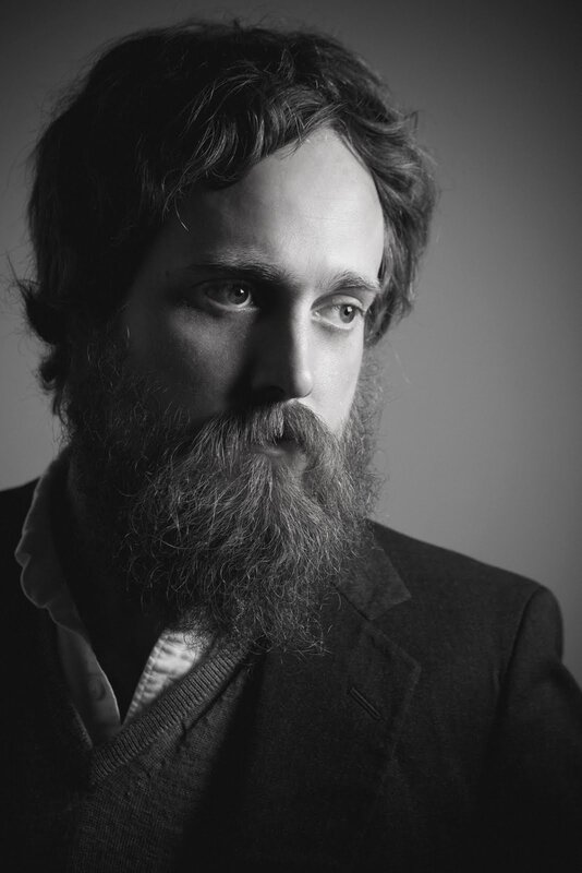 bearded man in black and white