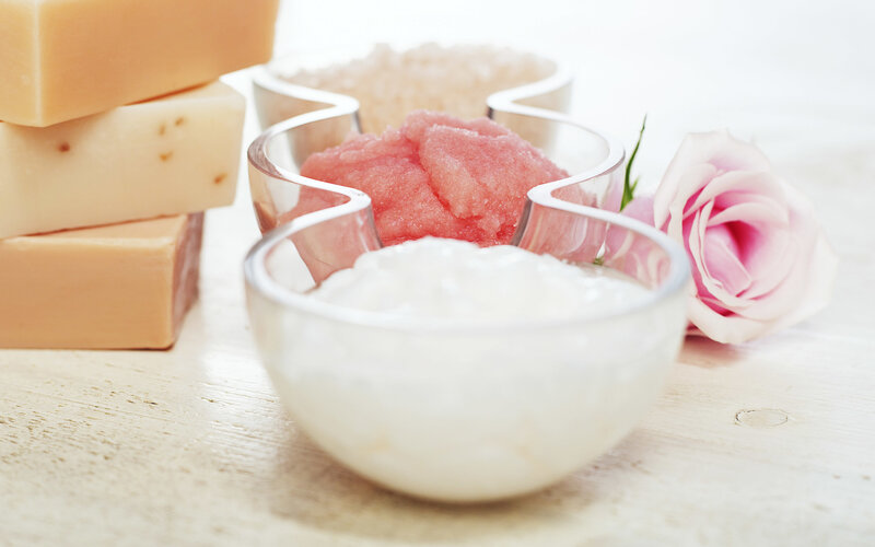Beauty products on wooden surface