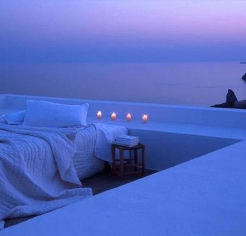 Bed on Balcony Overlooking Sea