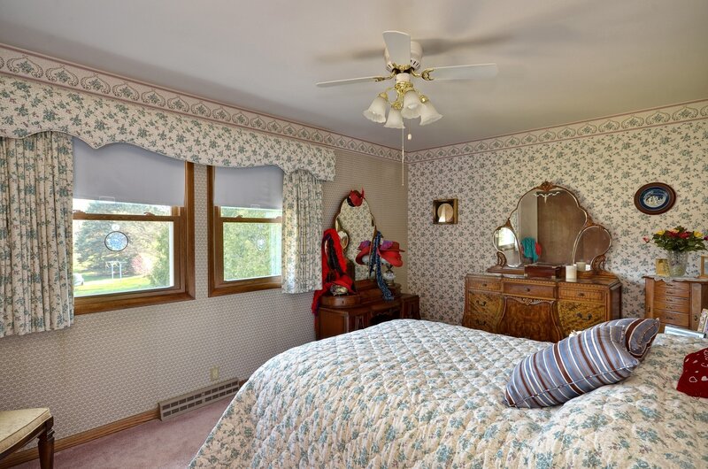 bedroom with floral wallpaper