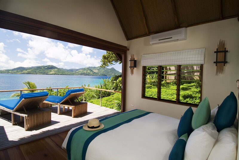 Bedroom with Ocean View — White, Serene, Afternoon, Photograph, Bed, Lounge Chairs
