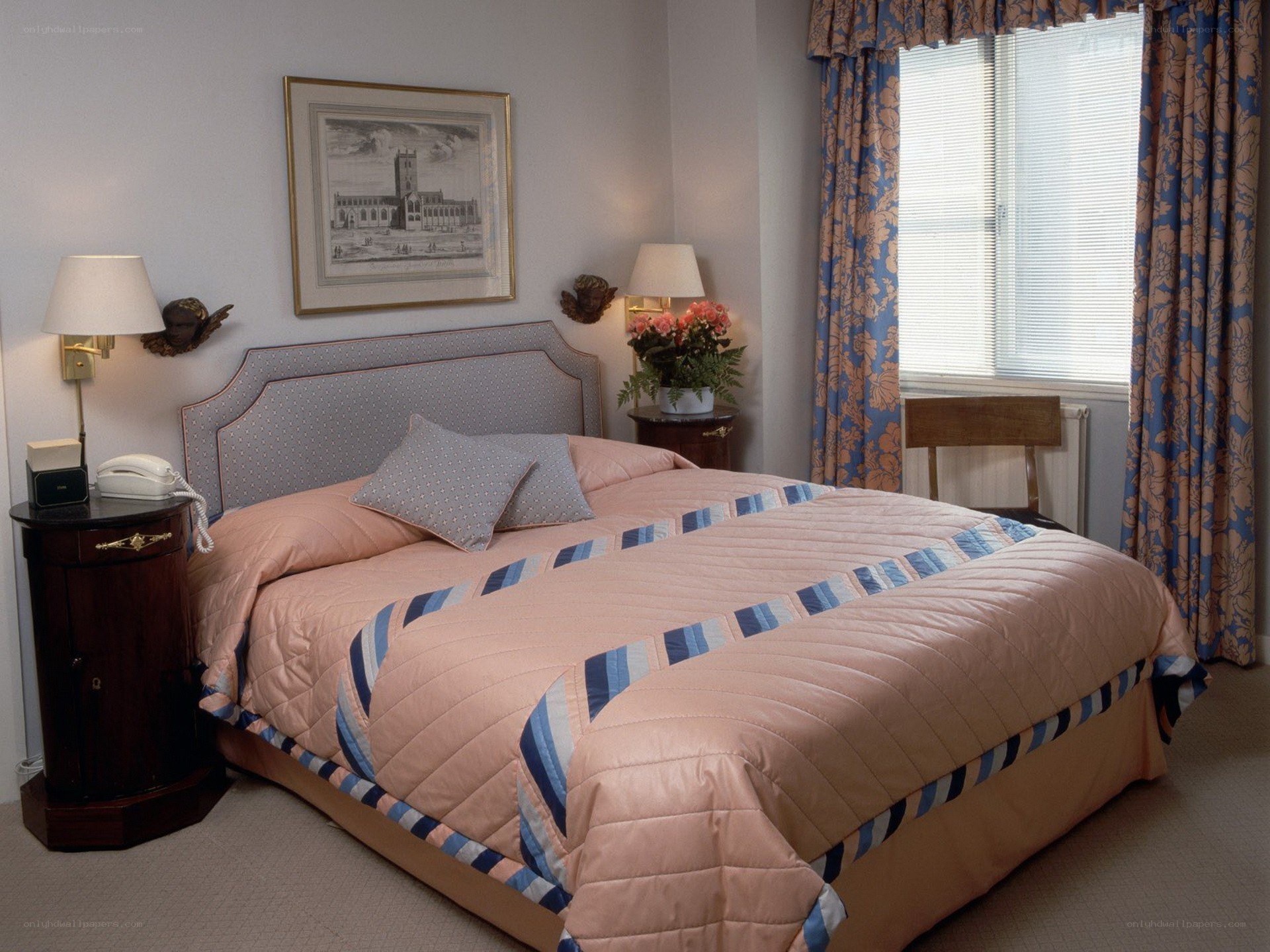 Bedroom with pink quilt