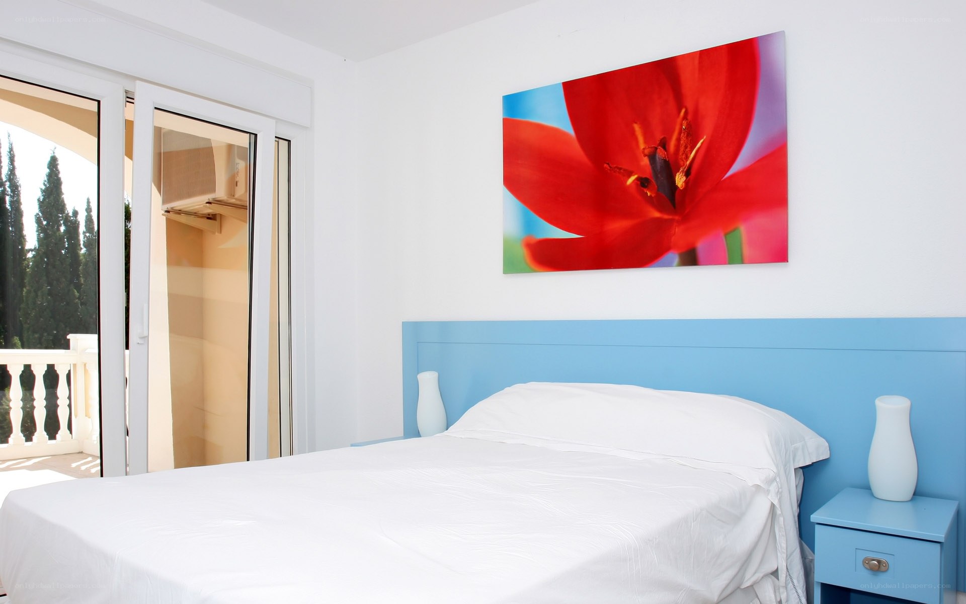 Bedroom with red flower art