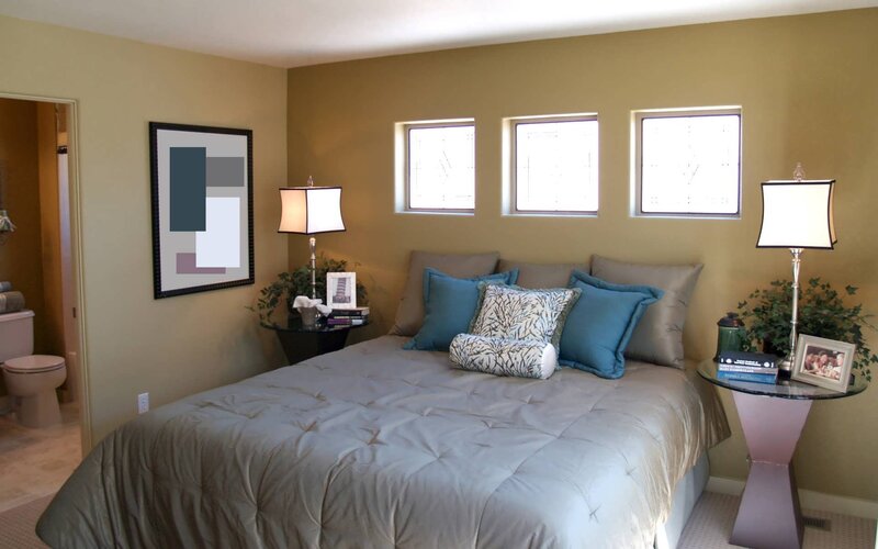 bedroom with three windows