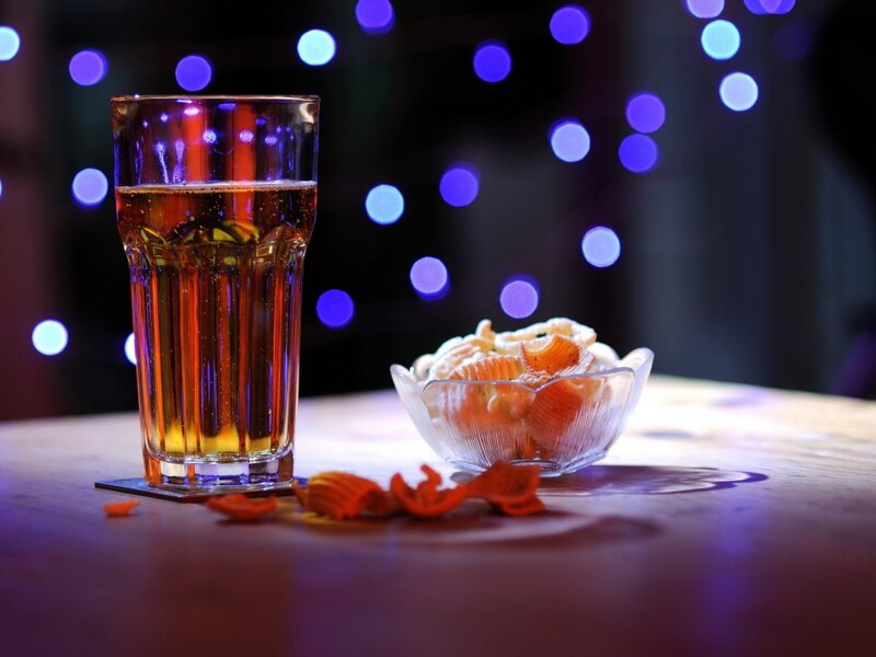 Beer and Chips on Table