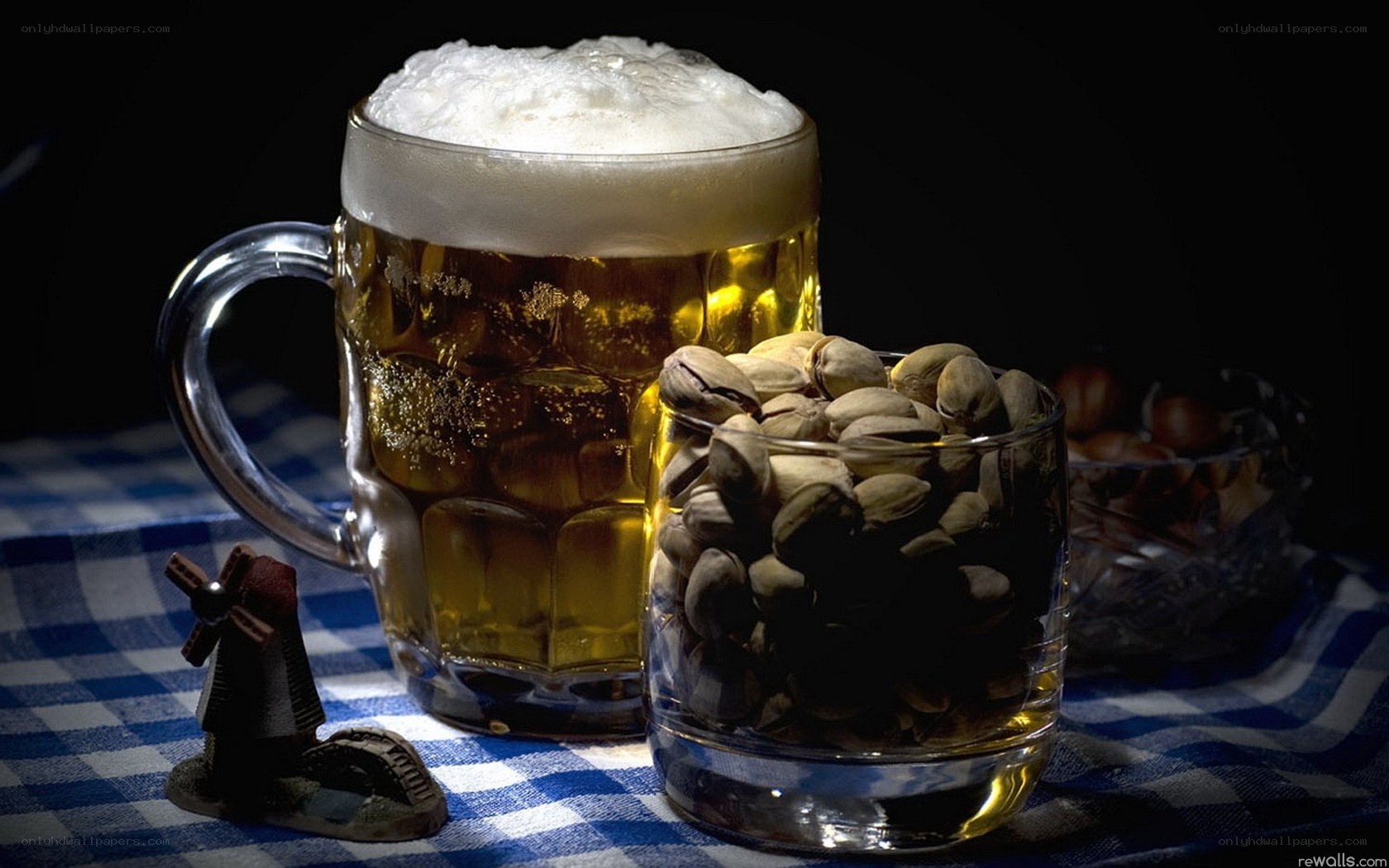 Beer and pistachios on checkered cloth