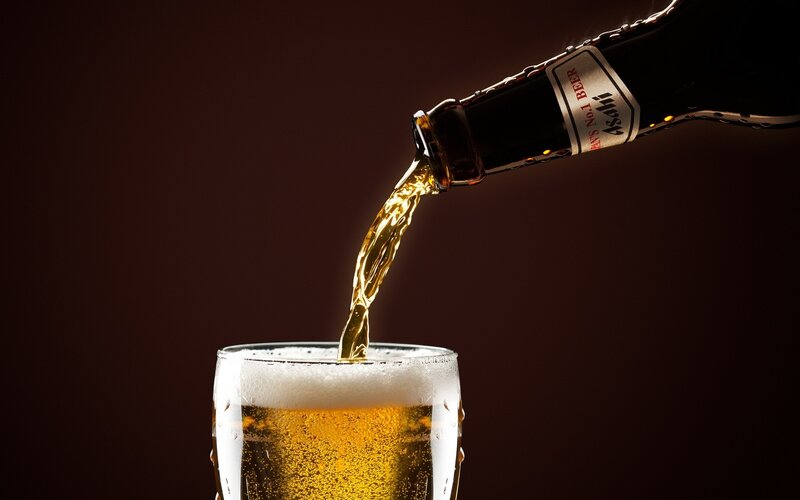 Beer Being Poured — Brown