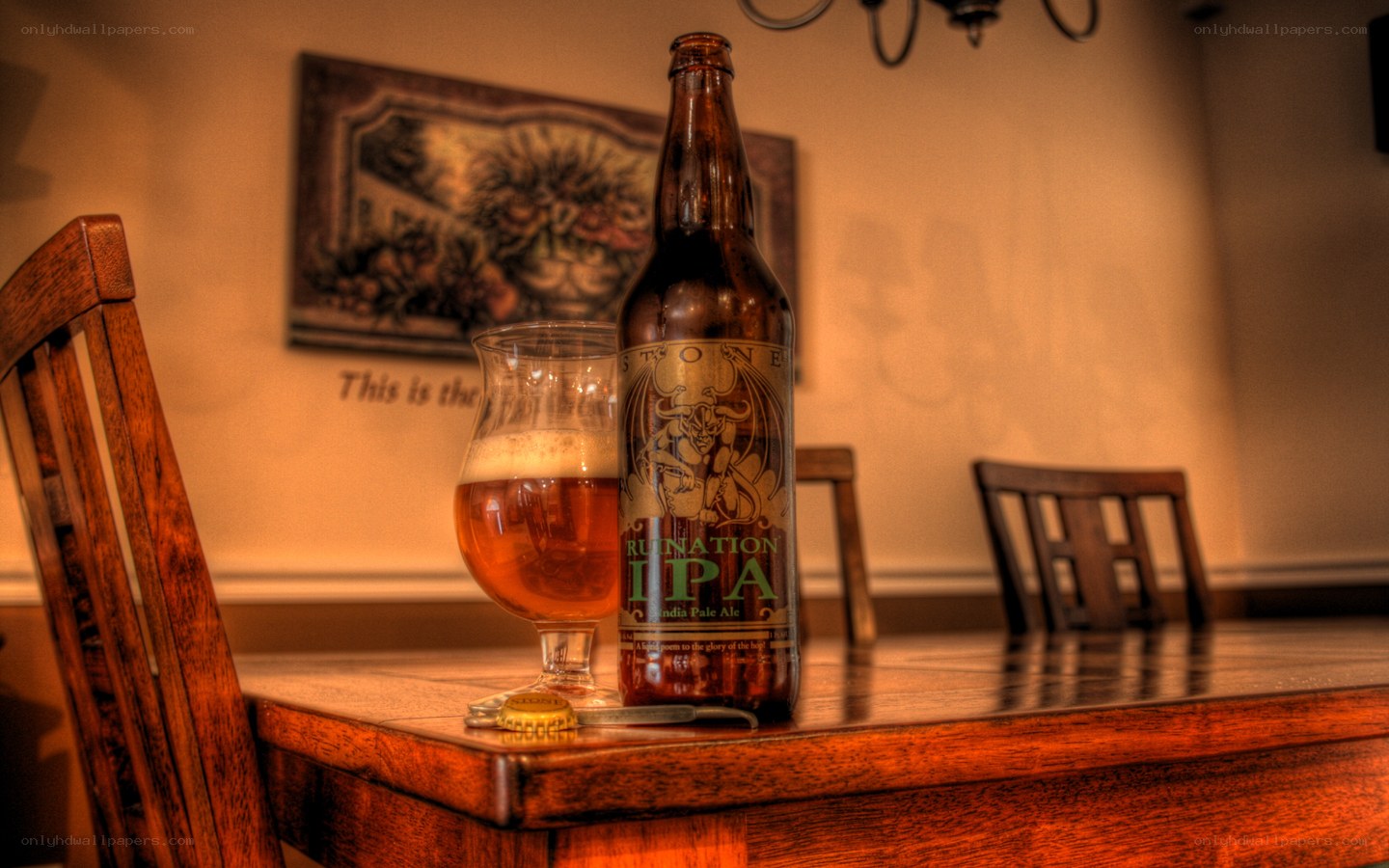 Beer bottle and glass on table