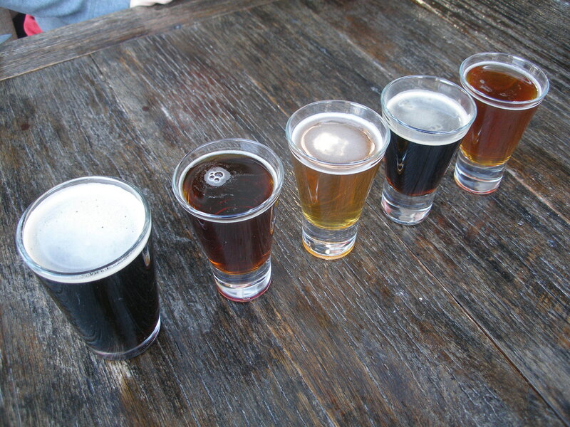 beer flight on wooden table