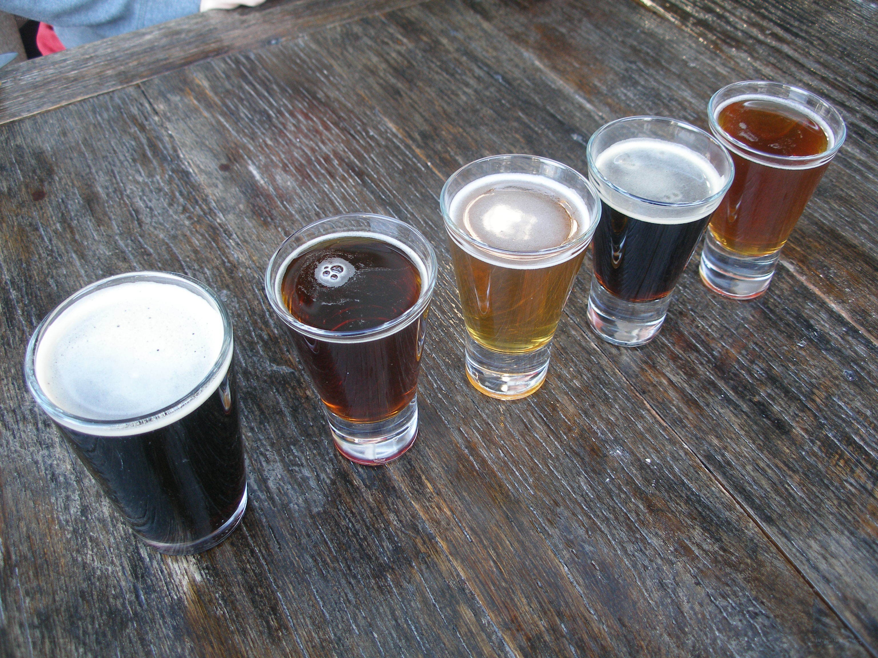 beer flight on wooden table