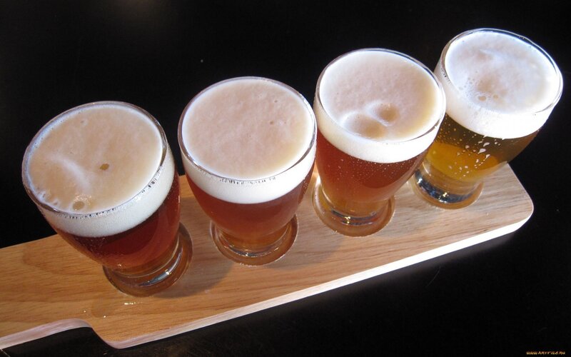 beer flight on wooden tray