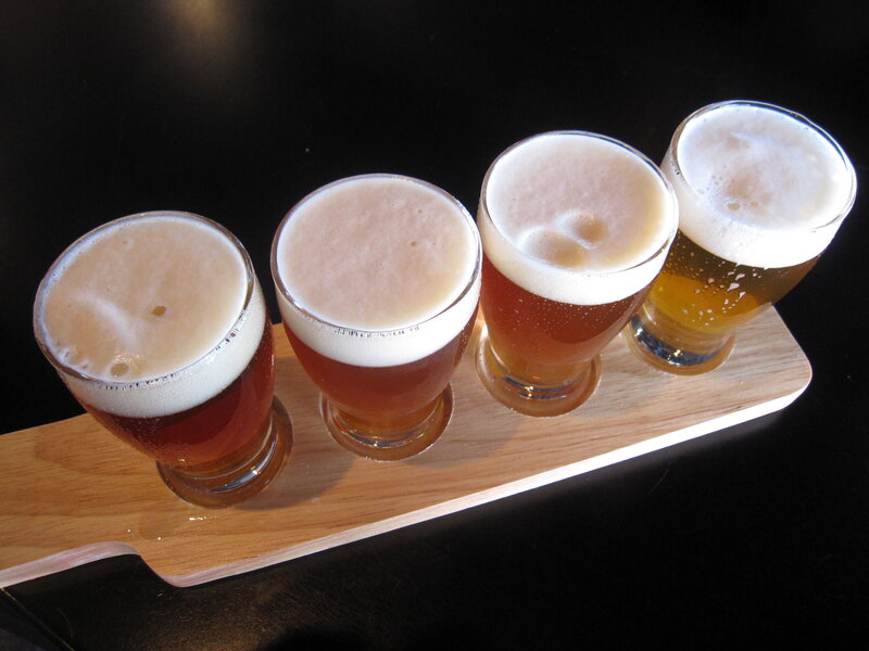 beer flight on wooden tray