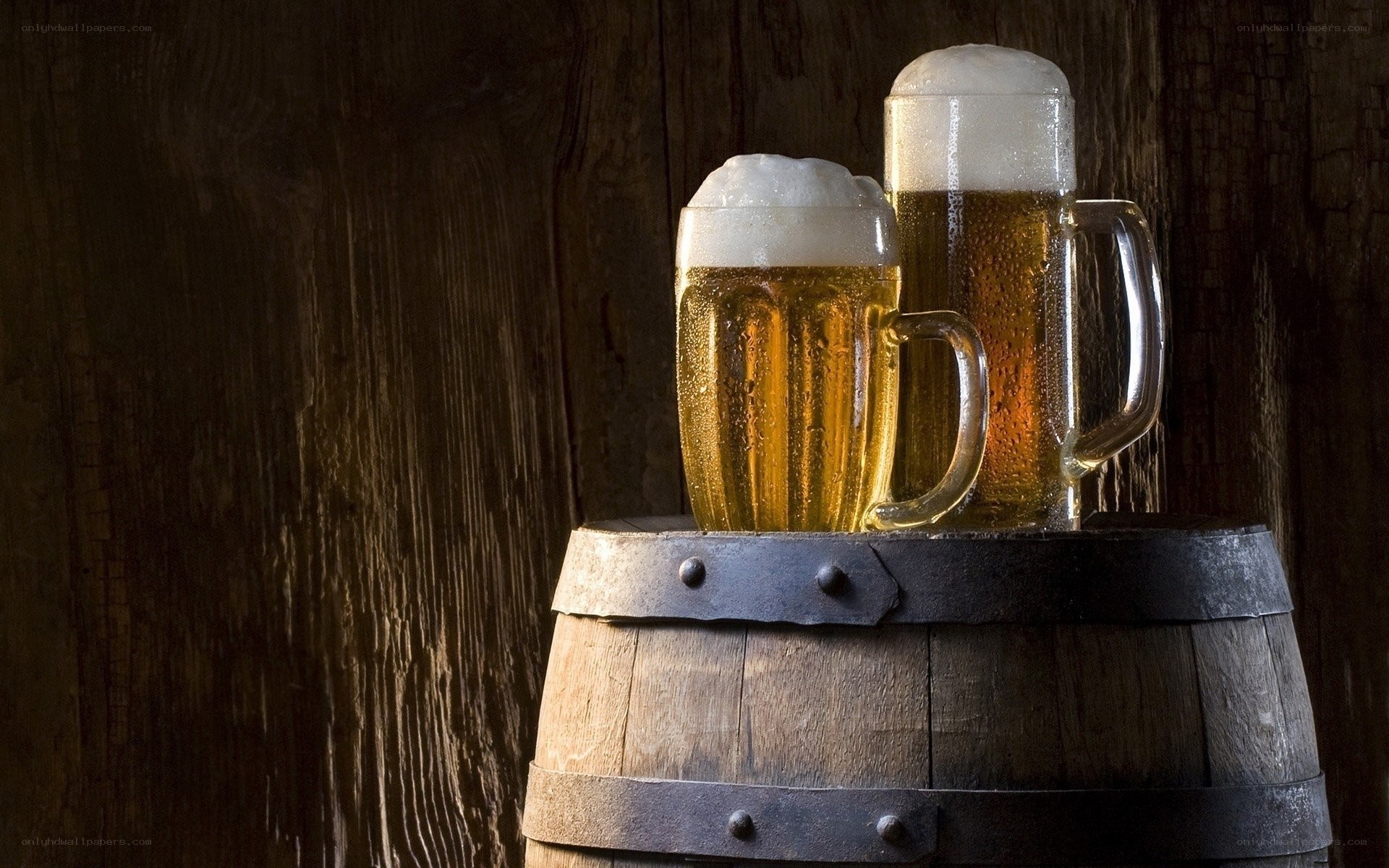 Beer mugs on a barrel
