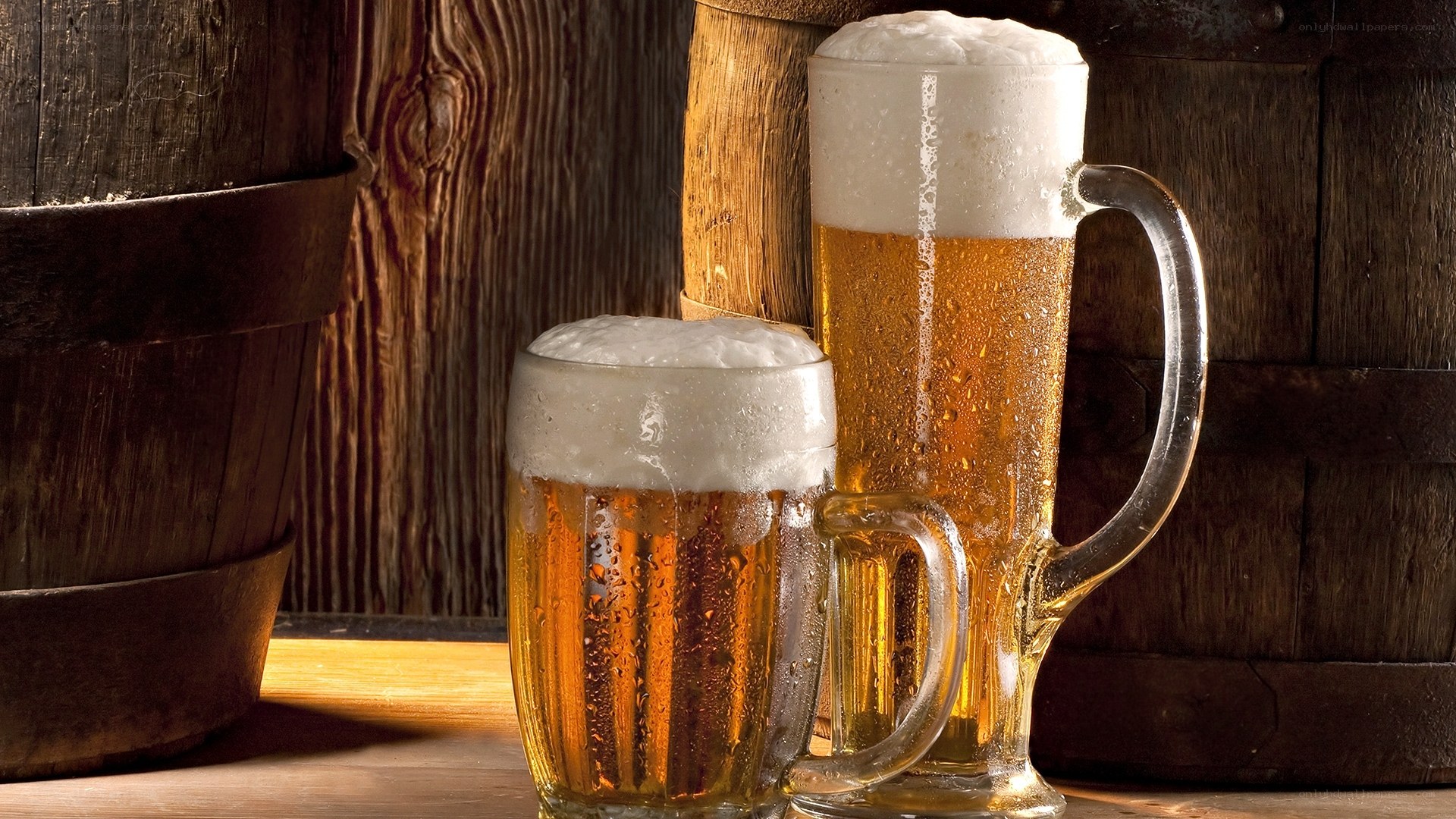 Beer mugs on wooden table
