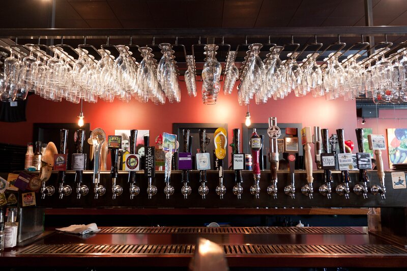 Beer taps and hanging glasses