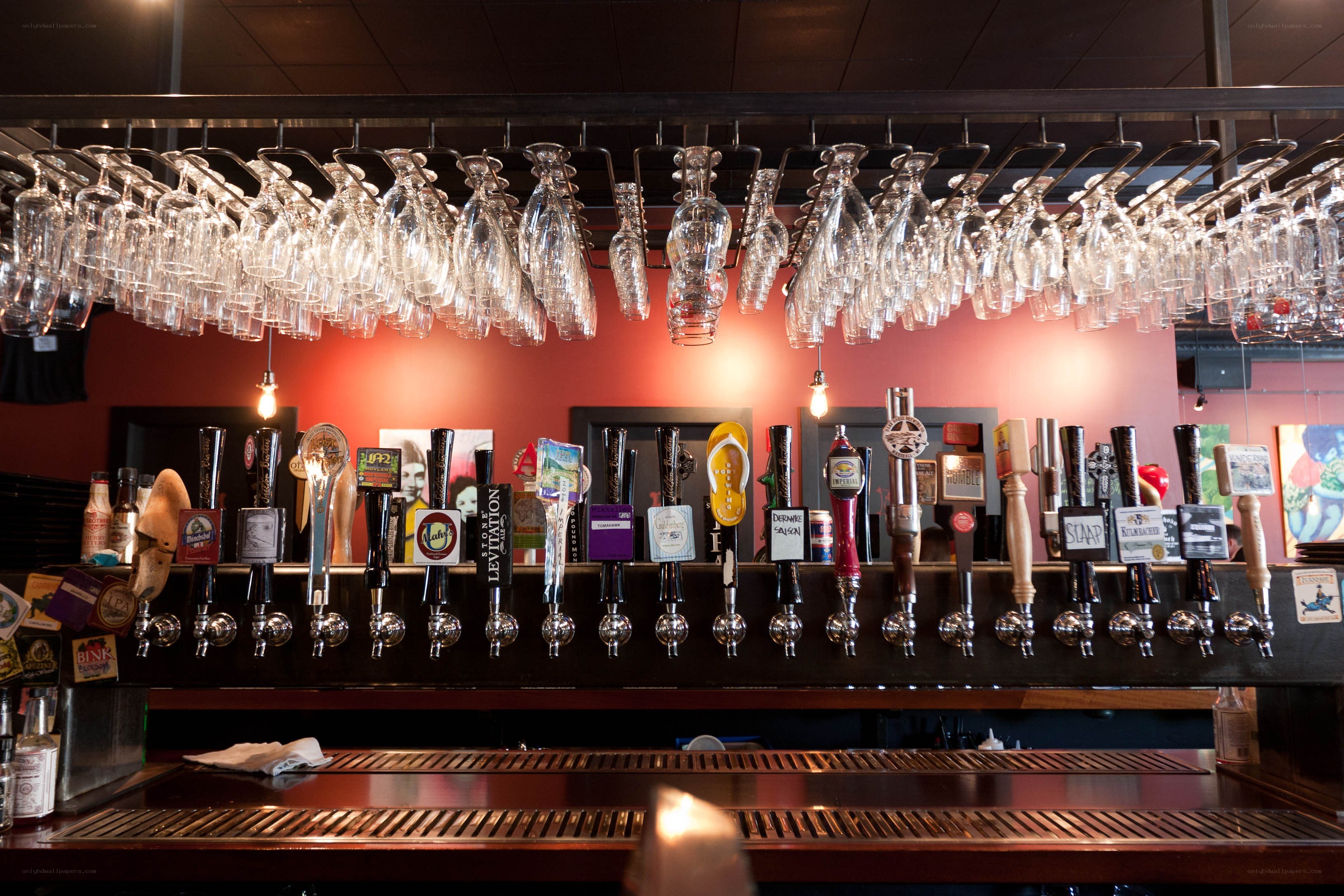 Beer taps and hanging glasses