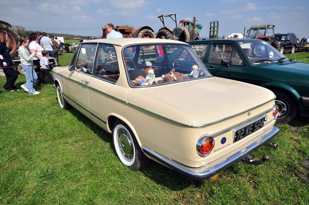 Beige BMW at outdoor car show