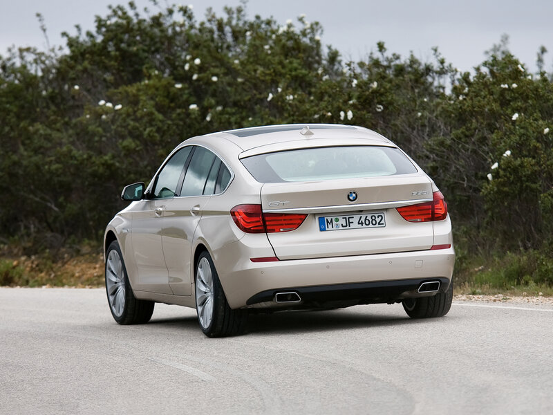 beige bmw gt on road