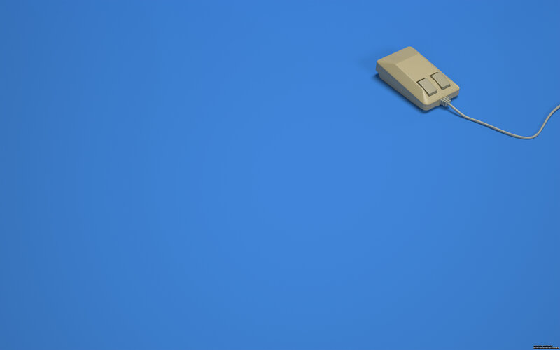 beige computer mouse on blue