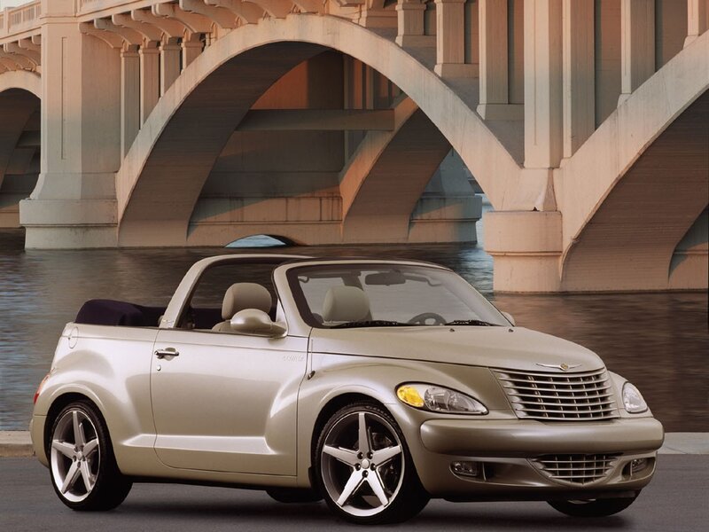 Beige convertible under a bridge