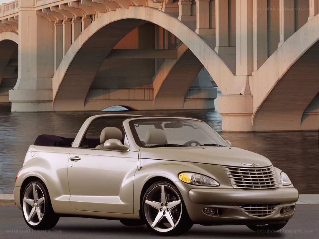 Beige convertible under a bridge